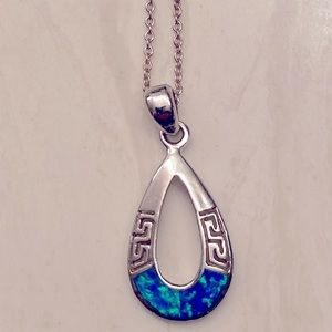 Sterling silver opal teardrop pendant with sterling chain. Rhodium plated.